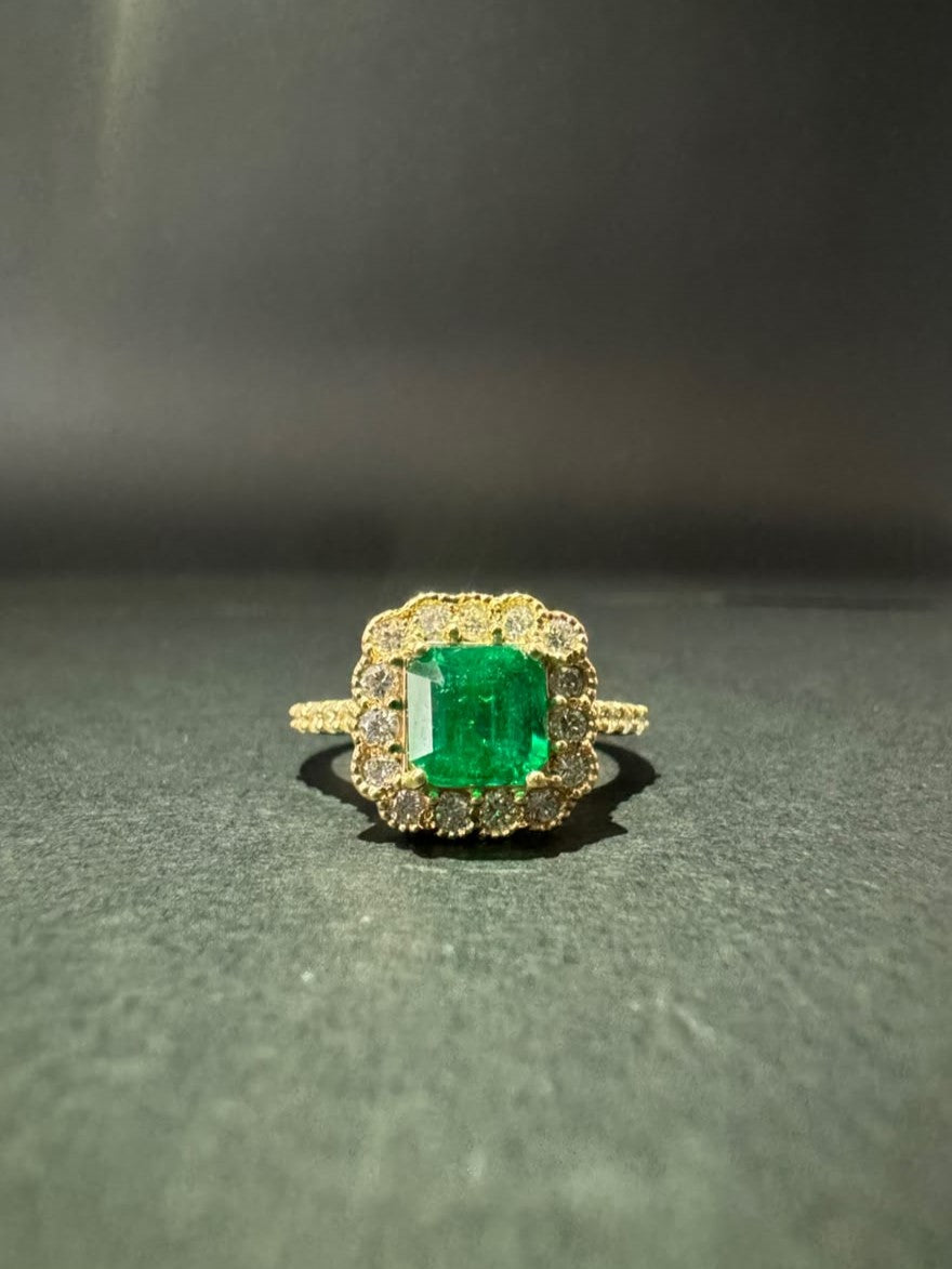 Square emerald ring in a diamond halo (Ref. 291)