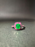 Emerald ring with a pink stone halo (Ref. 179)