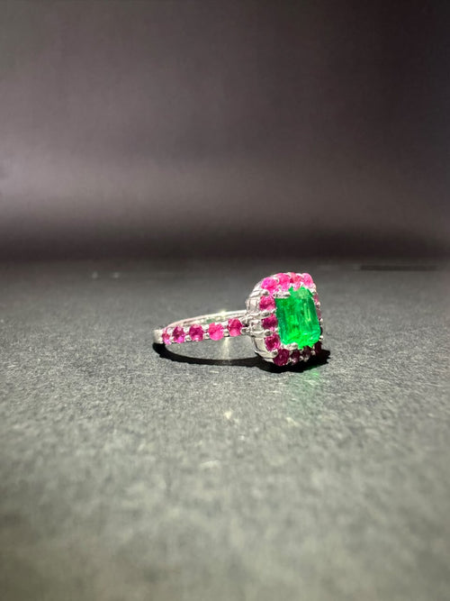 Emerald ring with a pink stone halo (Ref. 179)