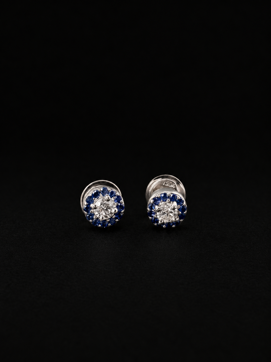 Diamond stud earrings with a blue stone halo (Ref. 283)